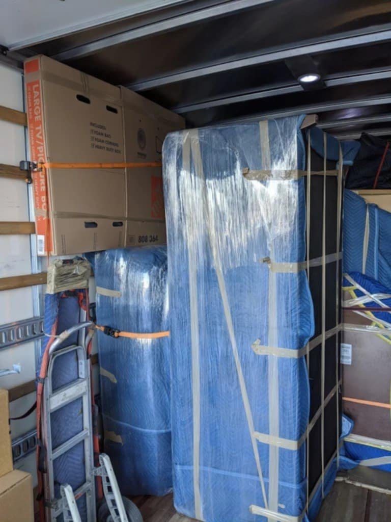 Professionally wrapped furniture in moving truck